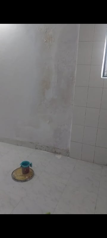 Bathroom in 1 BHK Apartment at Hakimi CHS, Goregaon West – for Rent