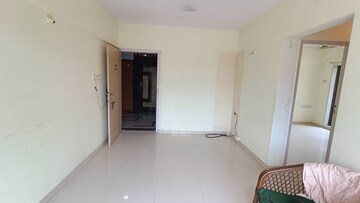 Room in 2 BHK Apartment at Prism Enclave, Kandivali East – for Rent