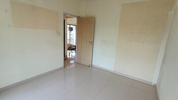Room in 2 BHK Apartment at Prism Enclave, Kandivali East – for Rent