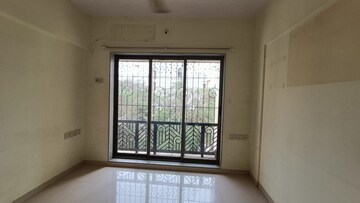 Room in 2 BHK Apartment at Prism Enclave, Kandivali East – for Rent