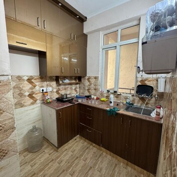 Kitchen in 2 BHK Apartment at Amrapali Golf Homes, Haibatpur – for Rent