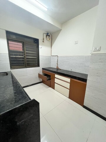 Kitchen in 2 BHK Apartment at Acme Ozone, Manpada – for Rent