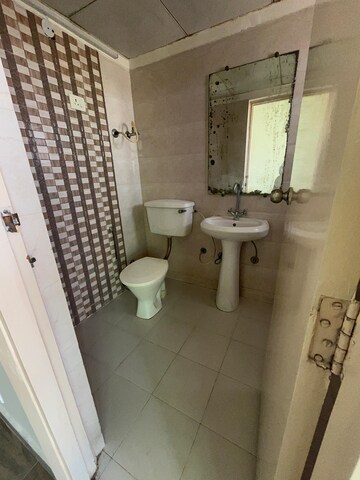 Bathroom in 2 BHK Apartment at Chi V Greater Noida – for Rent