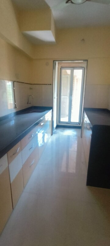 Kitchen in 3 BHK Apartment at Hubtown Greenwoods, Vartak Nagar – for Sale