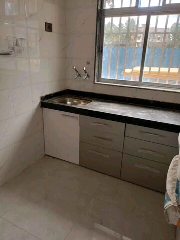 Kitchen in 1 BHK Apartment at Dev Ashray Bldg, Nalasopara West – for Sale