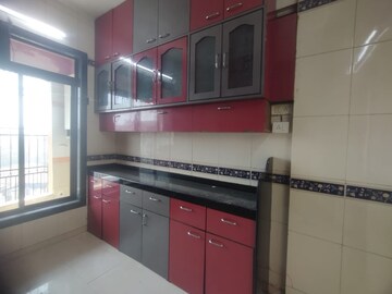 Kitchen in 3 BHK Apartment at Nandidham CHS, Seawoods – for Rent