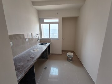 Kitchen in 1 BHK Apartment at Puraniks City Reserva, Ghodbunder Road – for Sale