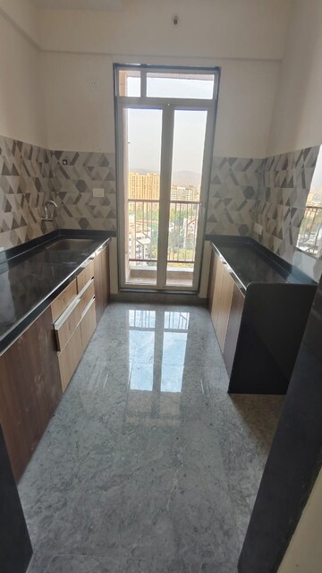 Kitchen in 1.5 BHK Apartment at Rosa Gardenia, Ghodbunder Road – for Sale