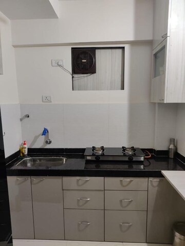 Kitchen in 2 BHK Apartment at Hiranandani Meadows, Manpada – for Rent