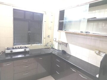 Kitchen in 1 BHK Apartment at Bindra Complex, Andheri East – for Rent