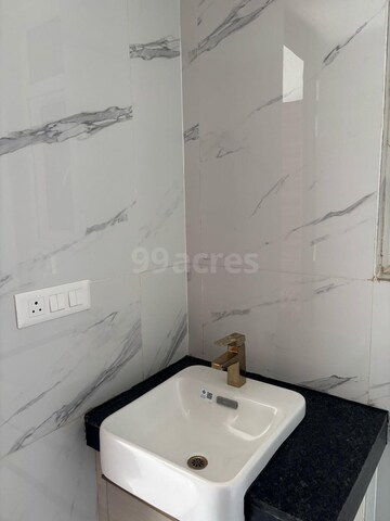 Bathroom in 2 BHK Apartment at Smart World Orchard, Sector 61 – for Sale