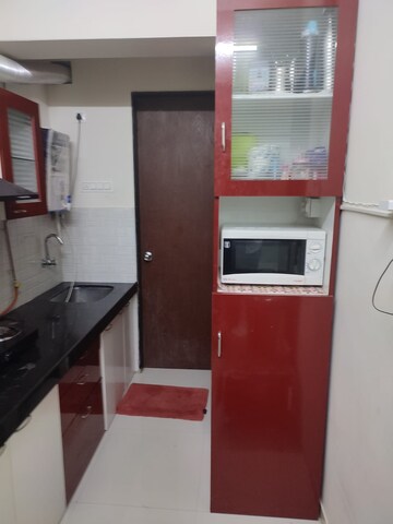 Kitchen in 1 BHK Apartment at Cosmos Orchid, Ghodbunder Road – for Rent