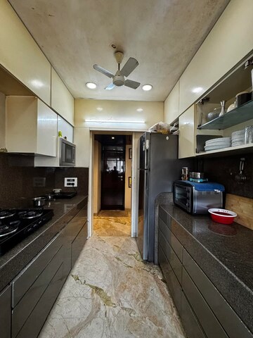 Kitchen in 4 BHK Apartment at Lodha Splendora, Ghodbunder Road – for Sale