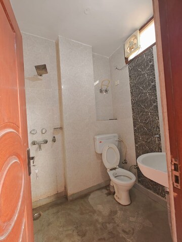 Bathroom in 1.5 BHK Builder Floor at Dwarka Mor – for Rent