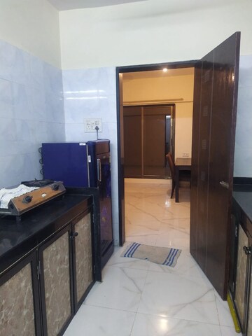 Kitchen in 2 BHK Apartment at Rohit Towers, Malad West – for Rent