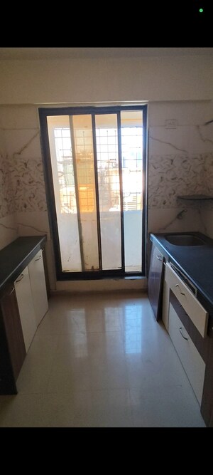 Kitchen in 1 BHK Apartment at Christine Heights, Mira Road – for Sale