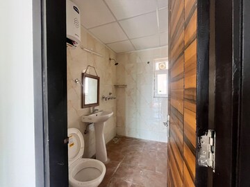 Bathroom in 3 BHK Apartment at Samridhi Daksh Avenue, Sector 150 – for Rent