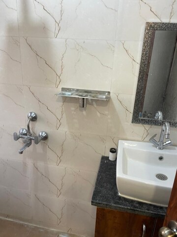 Bathroom in 1 RK Apartment at Emaar Emerald Floors Premier, Sector 65 – for Rent
