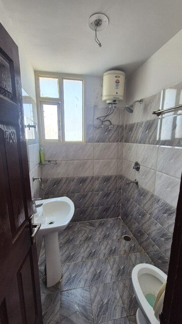 Bathroom in 2 BHK Apartment at Supreme Homes, Dhakoli Village – for Rent