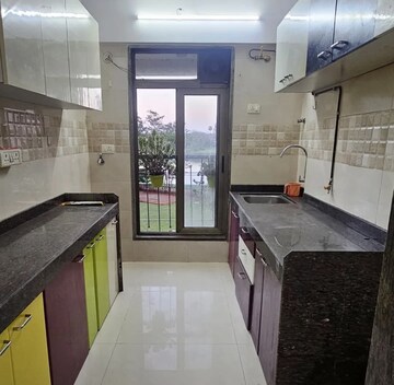 Kitchen in 1 BHK Apartment at Abrol Avirahi Heights, Malad West – for Sale