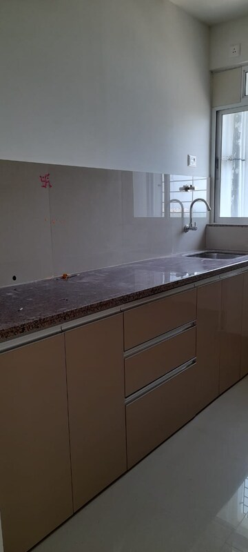 Kitchen in 1 BHK Apartment at Puranik Hometown, Ghodbunder Road – for Rent