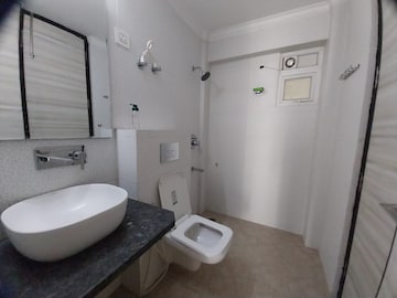 Bathroom in 3 BHK Apartment at Paradigm Business Hermitage Park, Dhakoli Village – for Sale