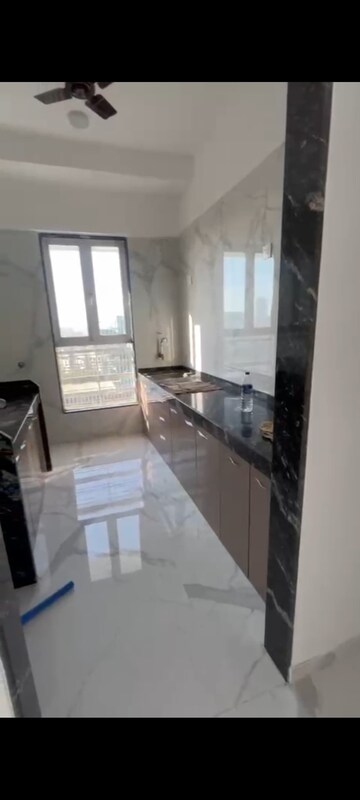Kitchen in 2 BHK Apartment at Pramanik Walchand Paradise, Mira Road – for Rent