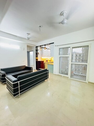 Living Room in 2 BHK Apartment at Aims Golf City, Sector 75 – for Rent