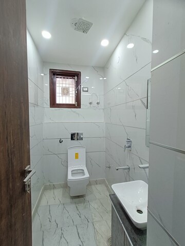 Bathroom in 3 BHK Builder Floor at Dwarka Mor – for Sale