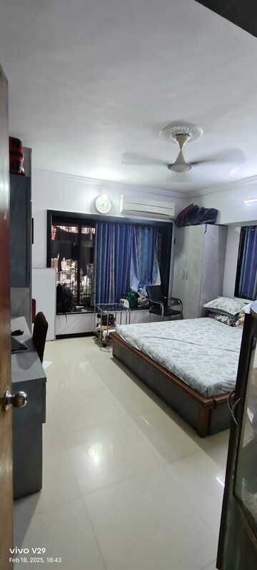 Bedroom in 2 BHK Apartment at Ratna Samuha CHS, Andheri West – for Rent