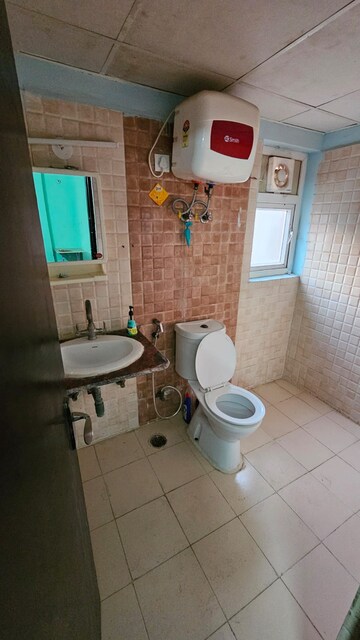 Bathroom in 2 BHK Apartment at Amrapali Silicon City, Sector 76 – for Rent