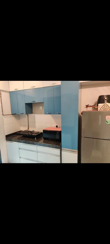 Kitchen in 2 BHK Apartment at Rustomjee Urbania, Majiwada – for Rent