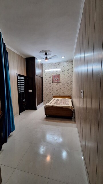 Bedroom in 1.5 BHK Builder Floor at Guru Nanak Enclave, Dhakoli Village – for Rent