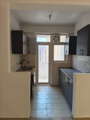 Kitchen in 2 BHK Apartment at Amrapali Silicon City, Sector 76 – for Rent