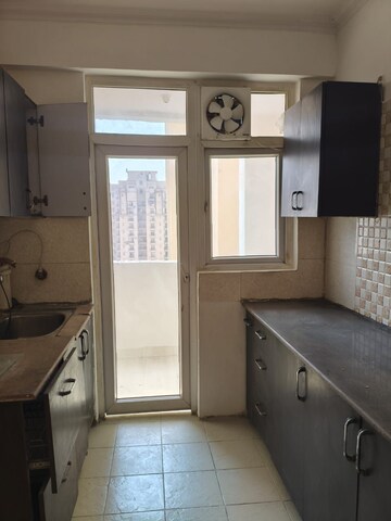 Kitchen in 2 BHK Apartment at Amrapali Silicon City, Sector 76 – for Rent