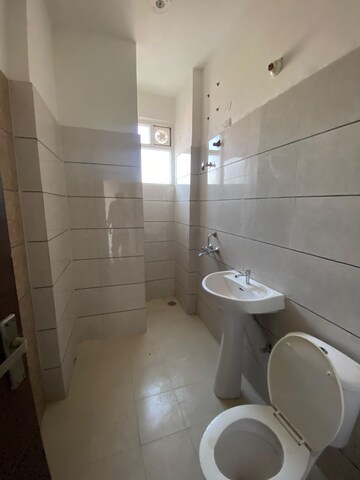 Bathroom in 3 BHK Apartment at Green Valley Heights, Dhakoli Village – for Sale