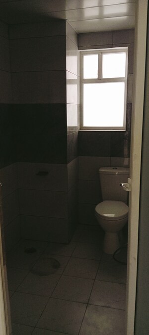 Bathroom in 3.5 BHK Apartment at Surat Residency, Vrinda Van Colony – for Sale