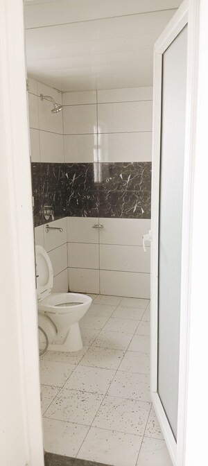 Bathroom in 3.5 BHK Apartment at Surat Residency, Vrinda Van Colony – for Sale