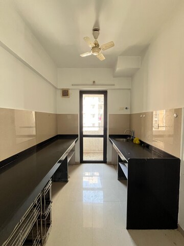 Kitchen in 1 BHK Apartment at Lodha Lakeshore Greens, Dombivli East – for Sale