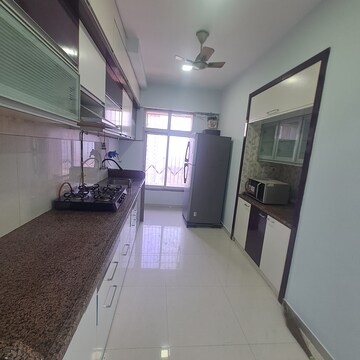 Kitchen in 2 BHK Apartment at Puranik Rumah Bali, Ghodbunder Road – for Rent