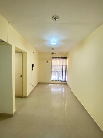 Living Room in 1 BHK Apartment at Lodha Crown Quality Homes Dombivli, Dombivli East – for Rent