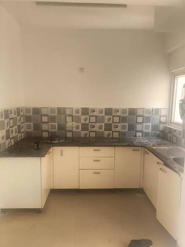 Kitchen in 2 BHK Apartment at Aims Golf Avenue I, Sector 75 – for Rent
