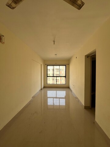 Living Room in 1 BHK Apartment at Lodha Crown Quality Homes Dombivli, Dombivli East – for Rent