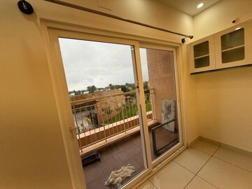Balcony in 2 BHK Apartment at Bhartiya Nikoo Homes Phase 2, Thanisandra Main Road – for Rent