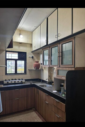 Kitchen in 2 BHK Apartment at Om Joshi Apartment, Vile Parle West – for Rent