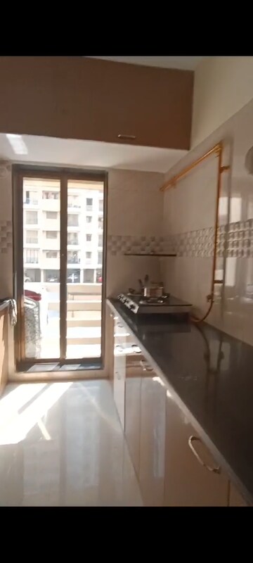 Kitchen in 2 BHK Apartment at Rustomjee Global City – for Rent