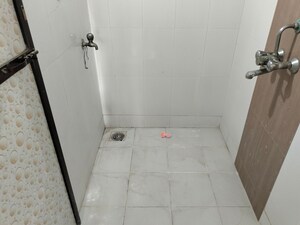 Bathroom in 1 BHK Apartment at Raunak Unnathi Woods, Ghodbunder Road – for Sale