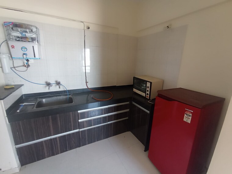 Kitchen, nyati-elan 2 Bedroom 560 Sq.Ft. Apartment In Wagholi Pune 8396392