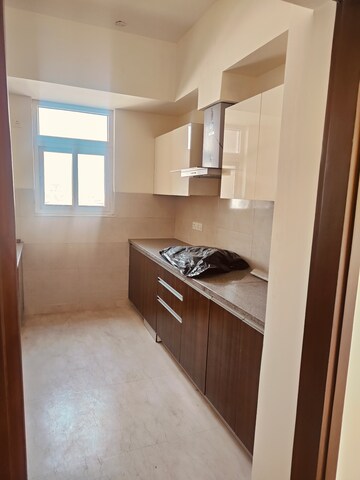 Kitchen in 2 BHK Apartment at Raj Nagar Extension – for Sale