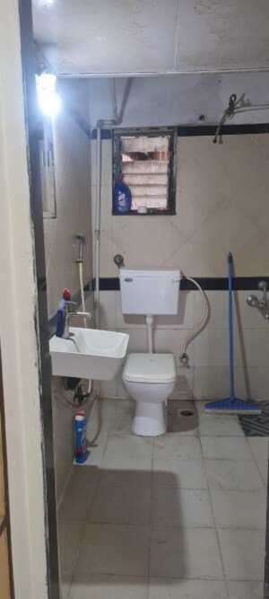 Bathroom in 2 BHK Apartment at New Mhada Towers, Andheri West – for Sale